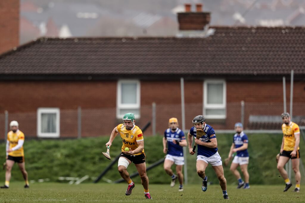 Antrim's Nigel Elliott in action against Aidan Corby of Laois during Sunday's league encounter. Photograph: Ben Brady/Inpho