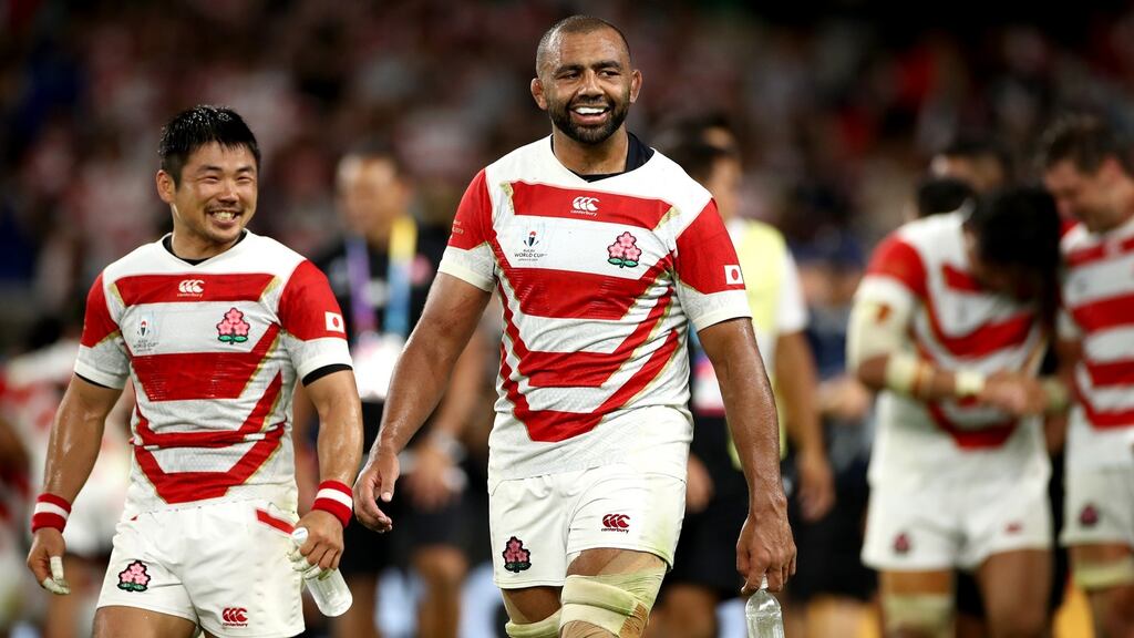Michael Leitch and Fumiaki Tanaka of Japan celebrate  following the  Group A victory over Ireland. Photograph:  Cameron Spencer/Getty Images