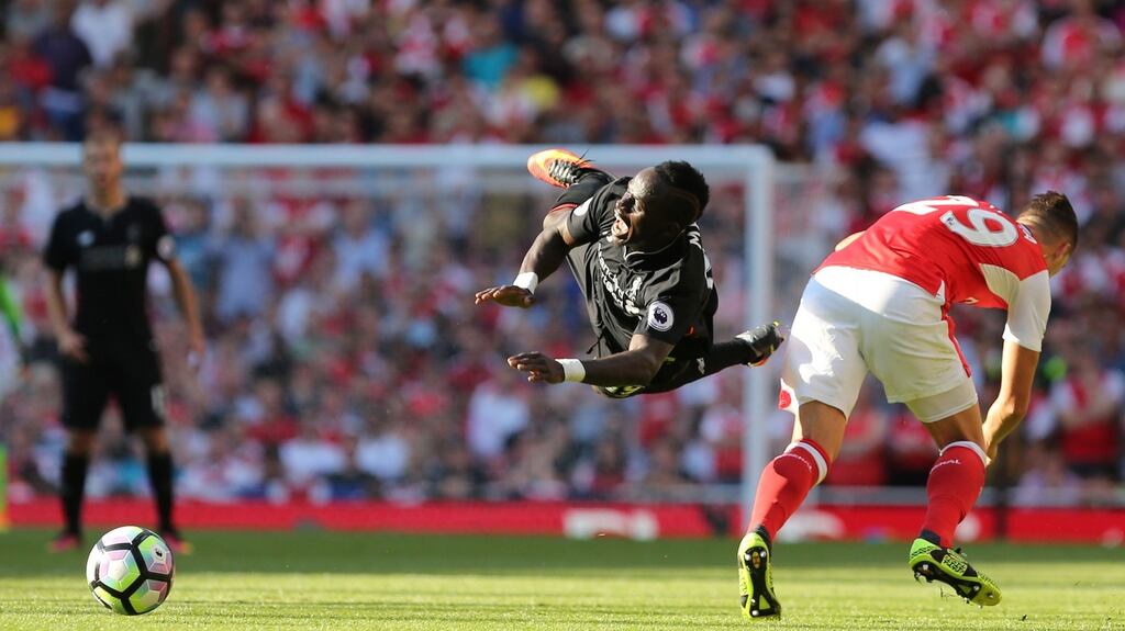 Arsenal’s Granit Xhaka  challenges Sadio Mane  at the Emirates Stadium. Photo: Getty Images