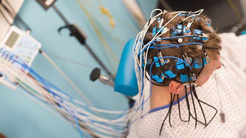 Epileptology unit, Nice, France Epilepsy diagnosis: EEG of patient hospitalised following seizures The EEG measures cerebral electrical activity Placing an EEG headset with straps enabling electrodes to be precisely positioned. Photograph: BSIP/UIG via Getty