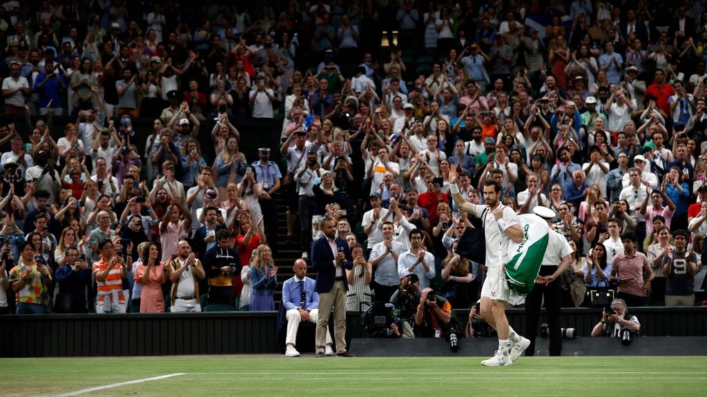 Andy Murray waves to fans at Wimbledon after he was knocked out last week. Photo: Adrian Dennis/AFP via Getty Images