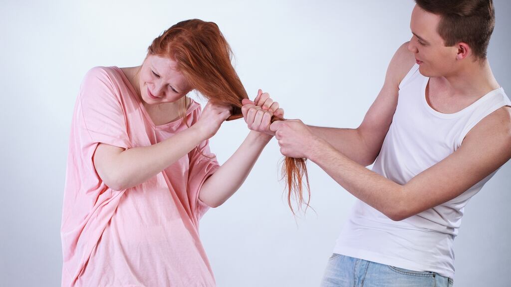 Stock image of a boy pulling a girl’s hair. Photograph: iStock