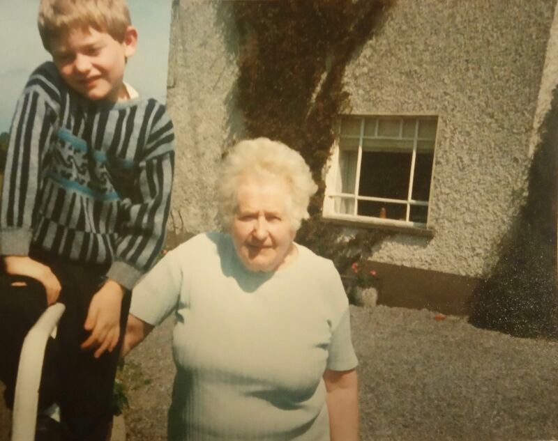 Morgan Fagg, as a child, pictured with his grandmother Una Fagg outside the Athlone farmhouse. Photograph: Supplied by Morgan Fagg