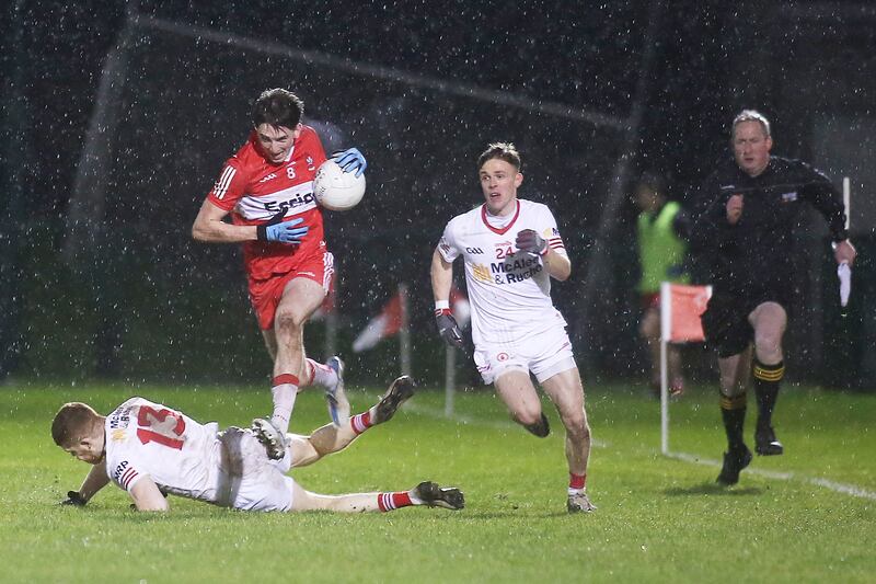 Derry’s Paul Cassidy in action against Tyrone’s Cathal McShane and Emmett McNabb in the Dr McKenna Cup in Owenbeg, Derry. Photograph: Lorcan Doherty/Inpho