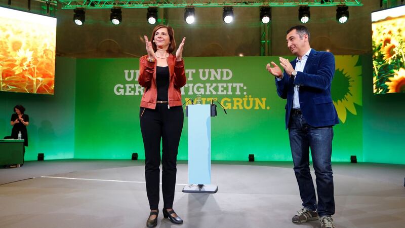 Greens candidates Katrin Göring-Eckardt and Cem Oezdemir: “If you want a stop sign for climate change, then you vote Green.” Photograph: Fabrizio Bensch/Reuters