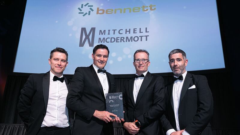 Andrew Howley, Awards Judge, presents the Tourism & Hospitality Project of the Year award to Bennett Construction & Mitchell McDermott team.