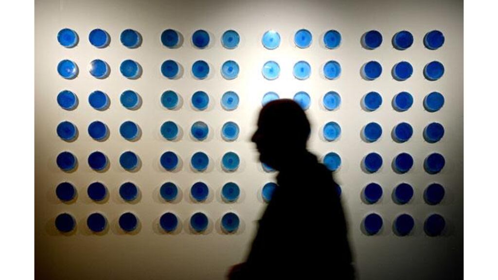 A person walks by a installation called Sound to Shape sound generated bacteriun pattern forming by Nurit Bar-Shal from the United States in the Science Gallery. Photograph: David Sleator/The Irish Times