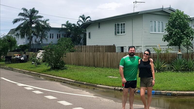 Tom Foley and his partner Emma Perry outside their home in Townsville in Queensland, where the flood water has finally receded and the big clean-up has begun.