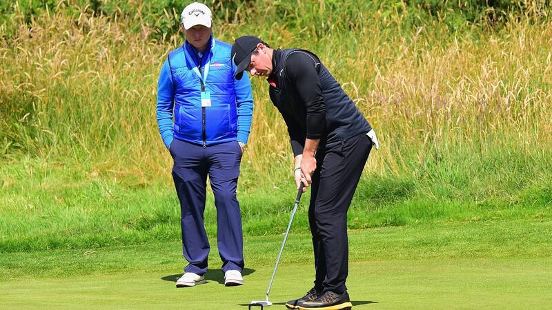 McIlroy practices his putting on Monday. At the Travelers Championship three week’s ago he was experimenting with four different flatsticks. Photo: Tony Marshall/Getty Images
