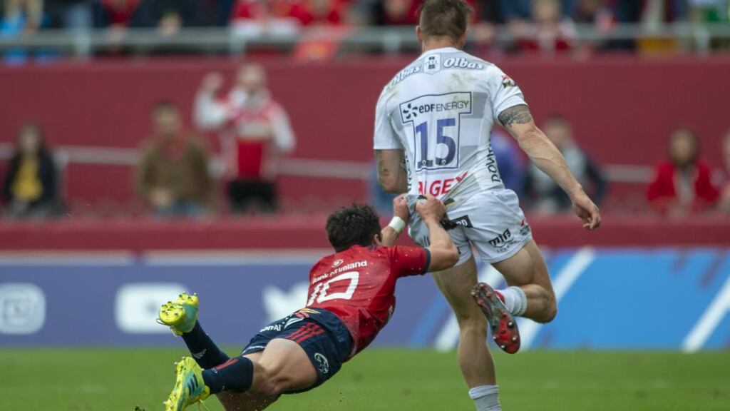 Jason Woodward of Gloucester is tackled by Joey Carbery of Munster during the Heineken Champions Cup match between the teams at Thomond Park on October 20th Photograph: Andrew Surma/NurPhoto/Getty
