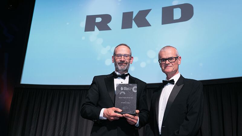 Noel McKernan, General Manager, HALT Natural Fire Retardant Treatment, presents the Green Project of the Year award to Donal Murphy, RKD.