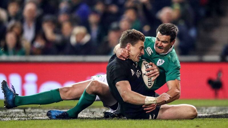New Zealand’s Beauden Barrett scores a try despite the efforts of Sexton during the 2016 game. Photo: Billy Stickland/Inpho
