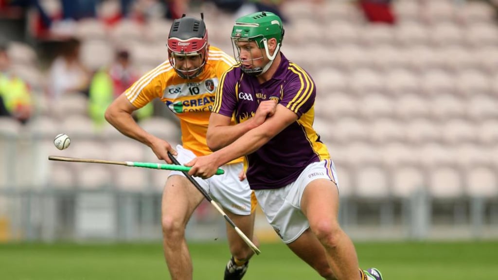 Antrim’s Maoi Connolly and Conor McDonald of Wexford in action during the Under-21 All-Ireland hurling semi-final. Photograph: Ryan Byrne/Inpho