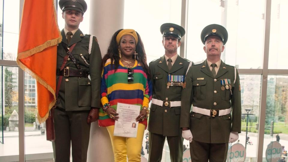 Esther Gaba with members of the Irish army after receiving her citizenship at UCC. Photograph: Michael Mac Sweeney/Provision