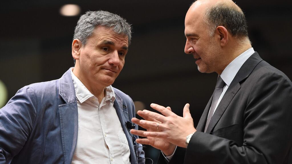 Greece’s finance minister Euclid Tsakalotos and European commissioner for Economic and Financial Affairs, Taxation and Customs Pierre Moscovici during an Ecofin meeting in Brussels on Wednesday. Photograph: Emmanuel Dunand/AFP/Getty