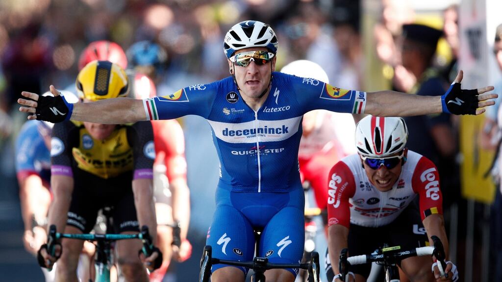 Italy’s Elia Viviani of Deceuninck Quick Step team celebrates his win as he crosses the finish line of fourth stage of the 106th edition of the Tour de France. Photo: Yoan Valat/EPA
