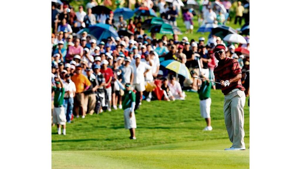 Thongchai Jaidee of Thailand chips on to the 18th during the final day's singles at the Royal Trophy tournament at the Amata Spring Country Club in Chonburi province, Thailand.