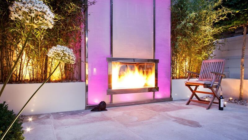 Kate Gould’s snazzy design uses glass, polished stainless steel and mirror to bring not just heat but illumination and colour to your garden. Photograph: The Garden Builders