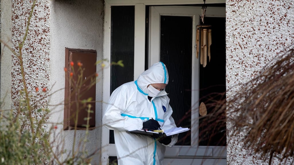 Gardaí on Friday examine the house in Ballyconnell, Co Wicklow, where a man was stabbed to death. Photograph: Colin Keegan/Collins