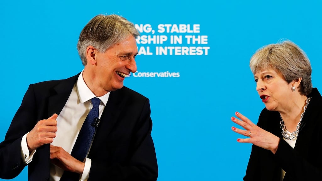 Chancellor Philip Hammond with British prime minister Theresa May at a press conference in Canary Wharf, London on Wednesday. May refused to confirm that Hammond would remain as chancellor after the election. Photograph: Stefan Wermuth/Reuters