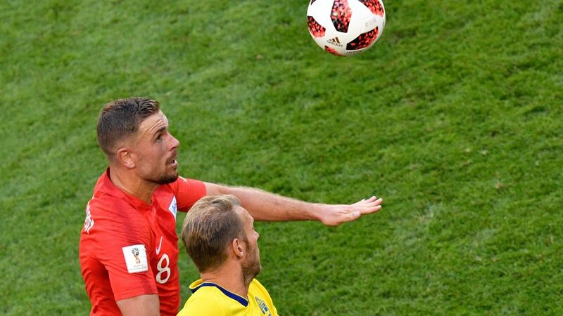 Jordan Henderson leaps above Sweden’s Ola Toivonen in Samara. Photograph: Alexander Nemenov/AFP/Getty