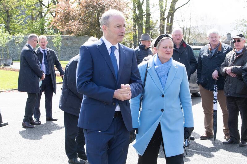 Taoisech Micheál Martin and Cllr Siobhan Ambrose arriving for the funeral mass of Michael O’Kennedy. Photograph Liam Burke/Press 22