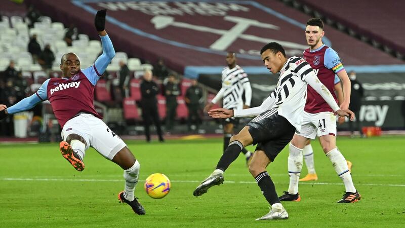 Manchester United’s Mason Greenwood scores his side’s second goal during the Premier League match against West Ham at The London Stadium. Photograph: Justin Setterfield/PA Wire