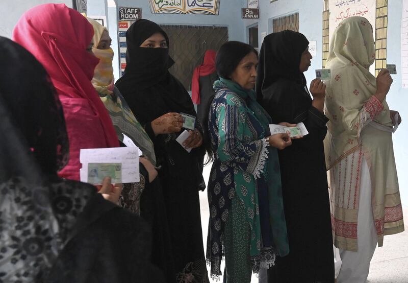 People line up to cast their votes during the elections for 20 provincial assembly seats in the most populous province of Punjab, in Lahore, Pakistan.
