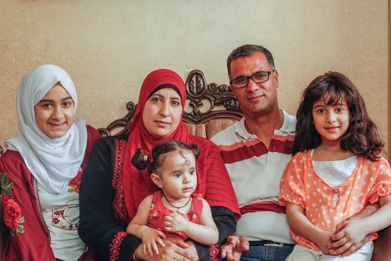 Sadya Khateeb, born and raised in Balata camp, with her husband Rahed and children. Photograph: Niall Sargent