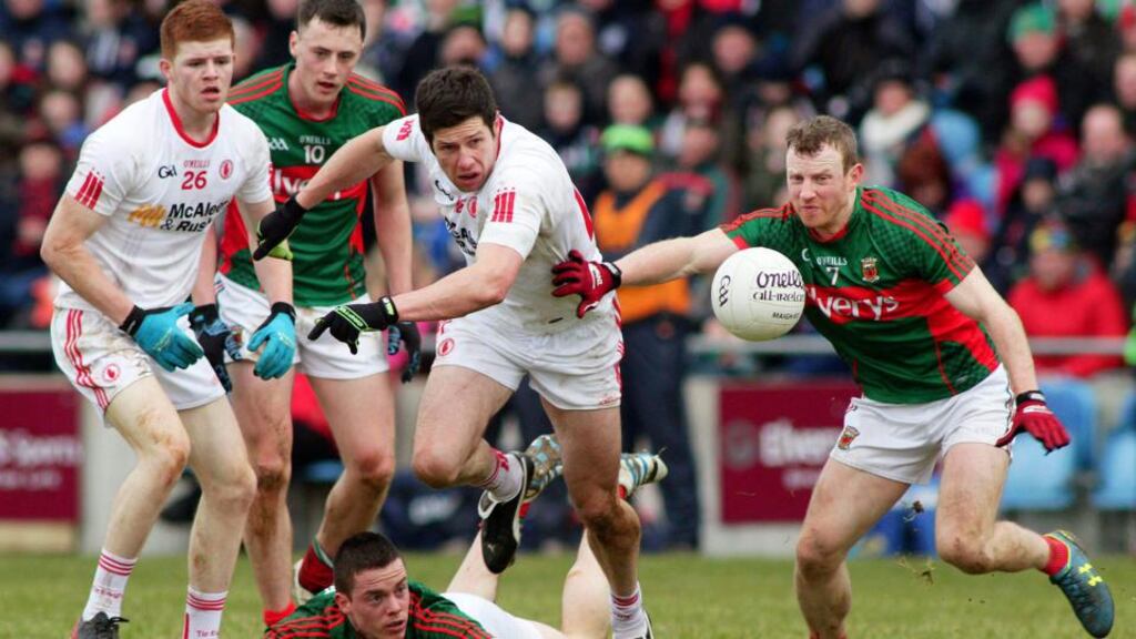 Sean Cavanagh battles for the ball with Mayo’s Colm Boyle on a day Tyrone ran out winners at MacHale Park. Photograph: Mike Shaughnessy/Inpho