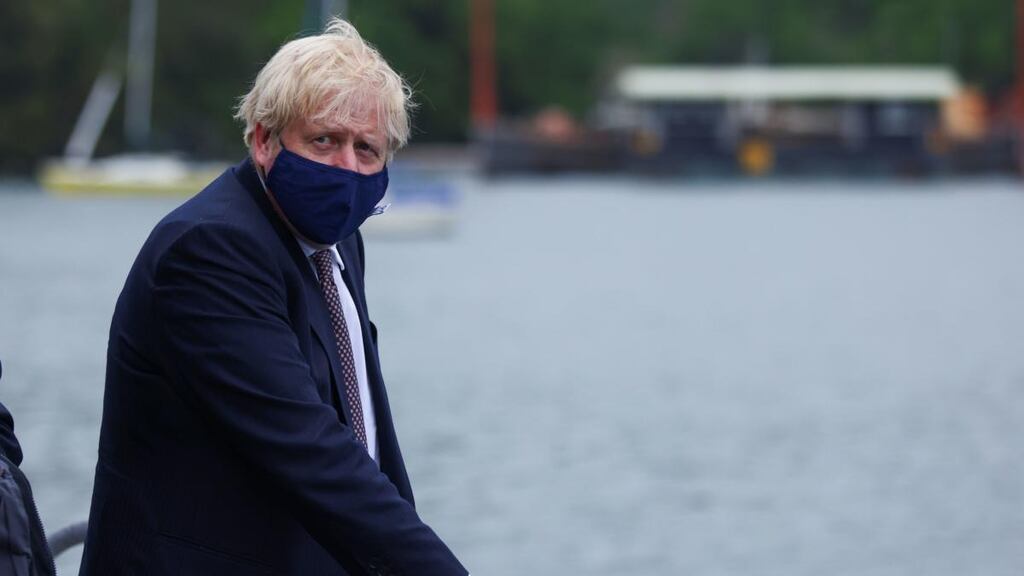 British prime minister Boris Johnson arrives by boat for a visit to the workshop of Scott Woyka Furniture in Falmouth, ahead of the G7 summit in Cornwall. Photograph: Tom Nicholson/PA Wire