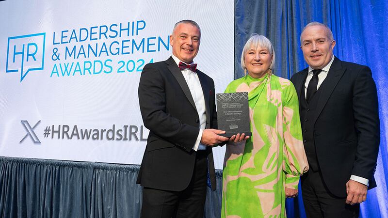 Terry Spence, director of sales, One4all rewards, presents the most effective rewards and benefits strategy award to Grainne Kennedy, BaxterStorey Ireland