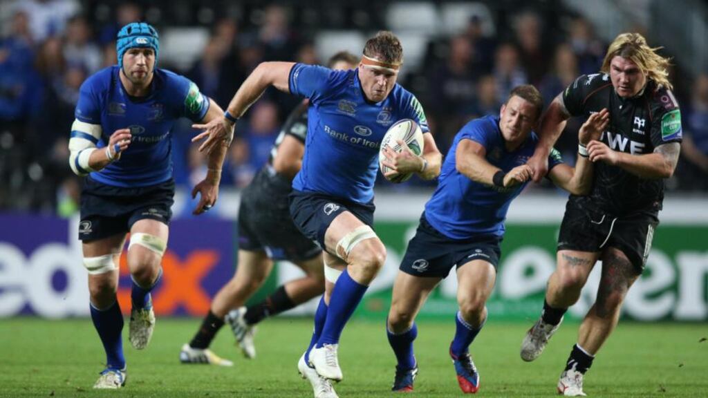 Jamie Heaslip charges up the field as Leinster get their quest for a fourth Heineken Cup crown off to a winning start against Ospreys. Photograph: Billy Stickland/Inpho