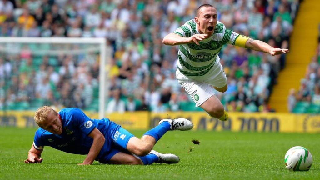 Celtic’s Scott Brown (right) is challenged by Inverness Caledonian Thistle’s Richie Foran at Celtic Park. Photograph: Russell Cheyne/Reuters