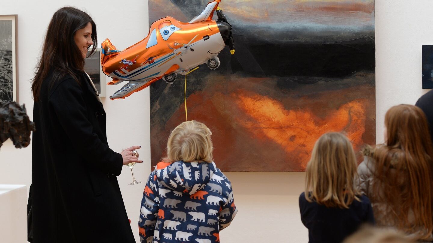 Fiona Cummins with her nephew Harry Oakley from Dalkey in front of a work by Hughie O Donoghue, Cumae: Pathway for Ghosts at the 186th RHA annual exhibition. Photograph: Cyril Byrne