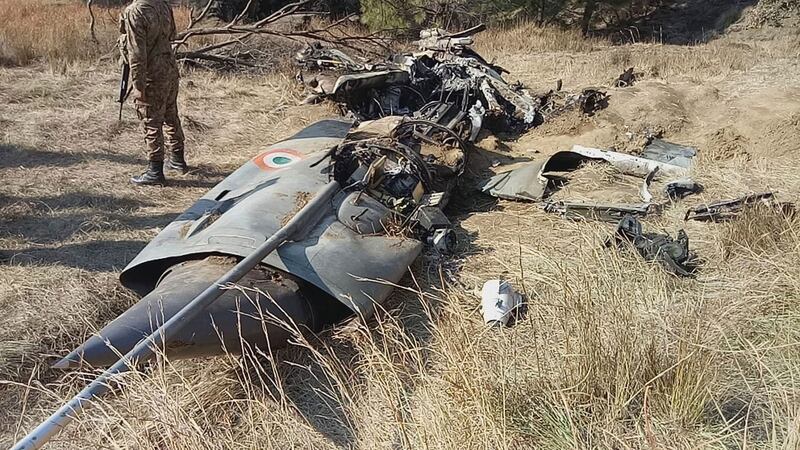 A Pakistani soldier stands guard near the wreckage of the fighter plane shot down by the Pakistan military on Wednesday. Photograph: Abdul Razzaq/AP
