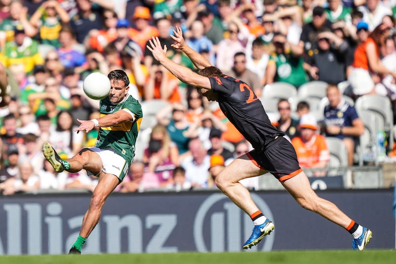 Micheál Burns of Kerry kicking a point against Armagh. Photograph: James Lawlor/Inpho