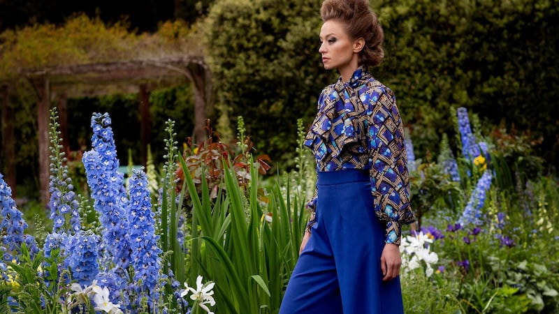 An Chros tie neck blouse €395, cobalt blue palazzos €595. Photograph: Una Williams