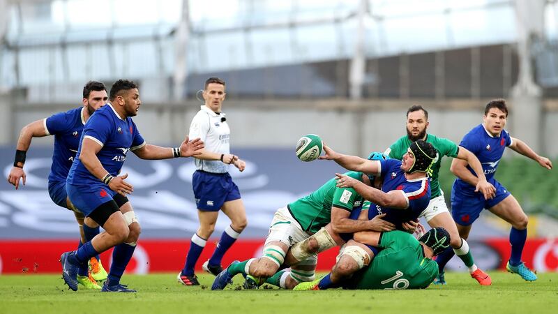 France’s Mohamed Haouas receives an offload from Gregory Alldritt. Photo: James Crombie/Inpho