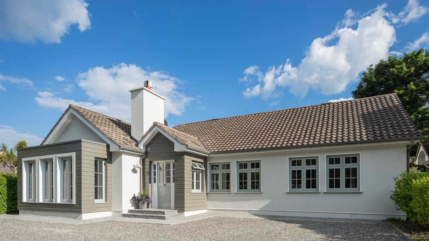 Exterior after: Drastic transformation achieved relatively simply through the use of timber, paint and render with simple, neutral colours