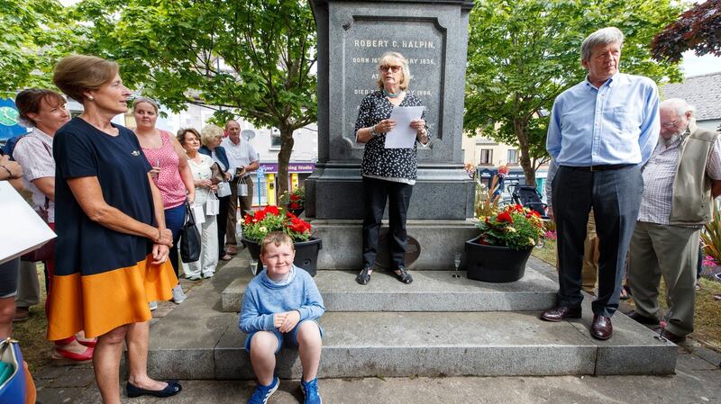 Guest of honour Marie Heaney, wife of the late Seamus, speaking to the crowd at the Halpin Monument in Wicklow town with current owner, goldsmith Joan Gelletlie (left) and husband Richard (right). Photograph: Andres Poveda