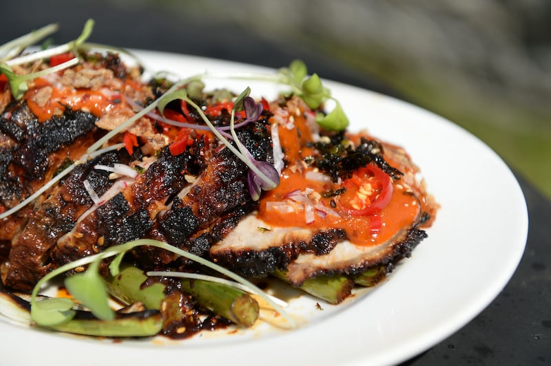 Ian Marconi’s Asian-style barbecued pork loin with Korean chilli seaweed sauce and charred greens. Photograph: Dara Mac Dónaill