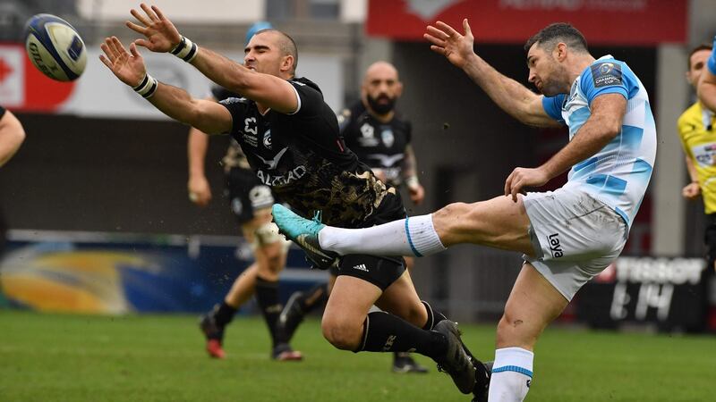 Leinster  fullback Rob Kearney clears under pressure from  Montpellier’s  scrumhalf Ruan Pienaar at Altrad Stadium. Photograph: Pascal Guyot/AFP/Getty