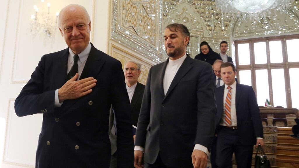 UN envoy to Syria Staffan de Mistura (left) and Iran’s deputy foreign minister Hossein Amir-Abdollahian arrive for a meeting in Tehran. Photograph: Atta Kenare/AFP/Getty Images
