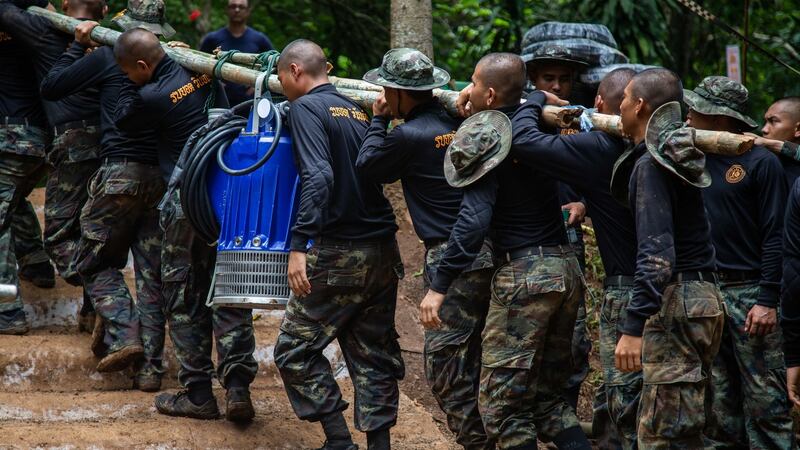 Thai military bring water pumps during the ongoing rescue operation for the child soccer team and their assistant coach at Tham Luang cave in Chiang Rai province, Thailand. Photograph: Lauren DeCicca/Getty Images