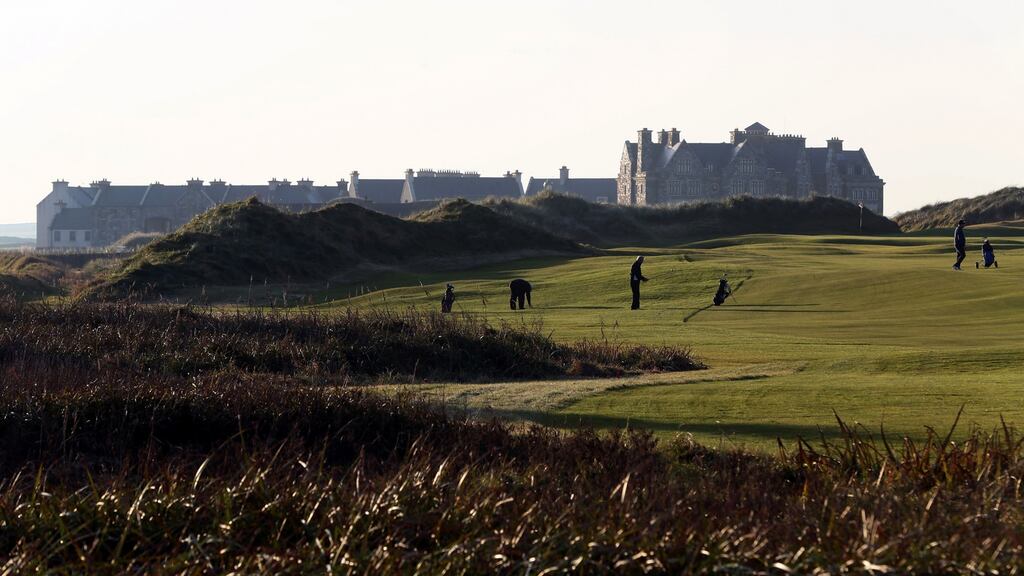 Golfers play on the fairway towards the clubhouse at Trump International Golf Course, near Doonbeg, Co Clare. Photograph: Paul Faith/AFP/Getty Images