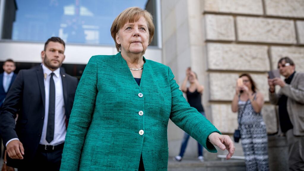 German Chancellor Angela Merkel leaves the Reichstag housing the Bundestag after a meeting with the leadership of her conservative Christian Democratic Union (CDU) party on Wednesday in Berlin. Photograph: Michael Kappeler/AFP/Getty