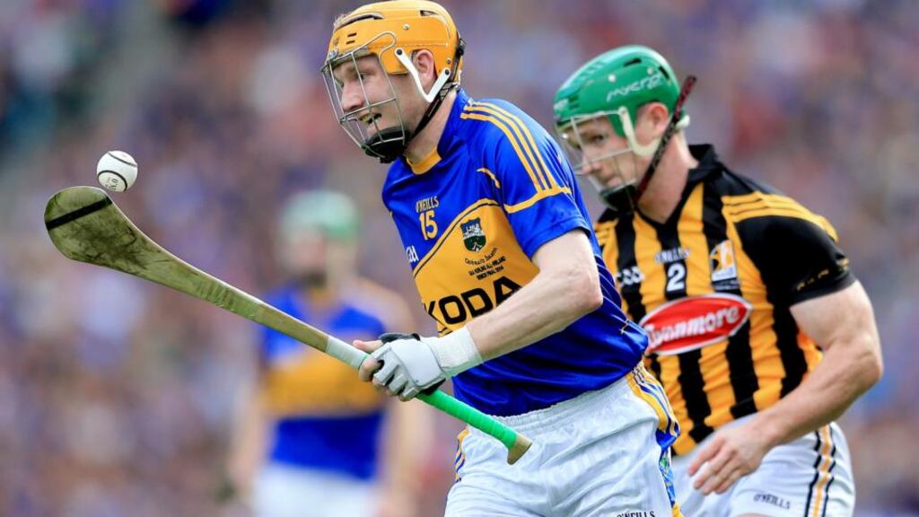 Tipperary’s Lar Corbett 
and Paul Murphy of Kilkenny in full flight during the high-scoring drawn All-Ireland final. Photograph: James Crombie/Inpho