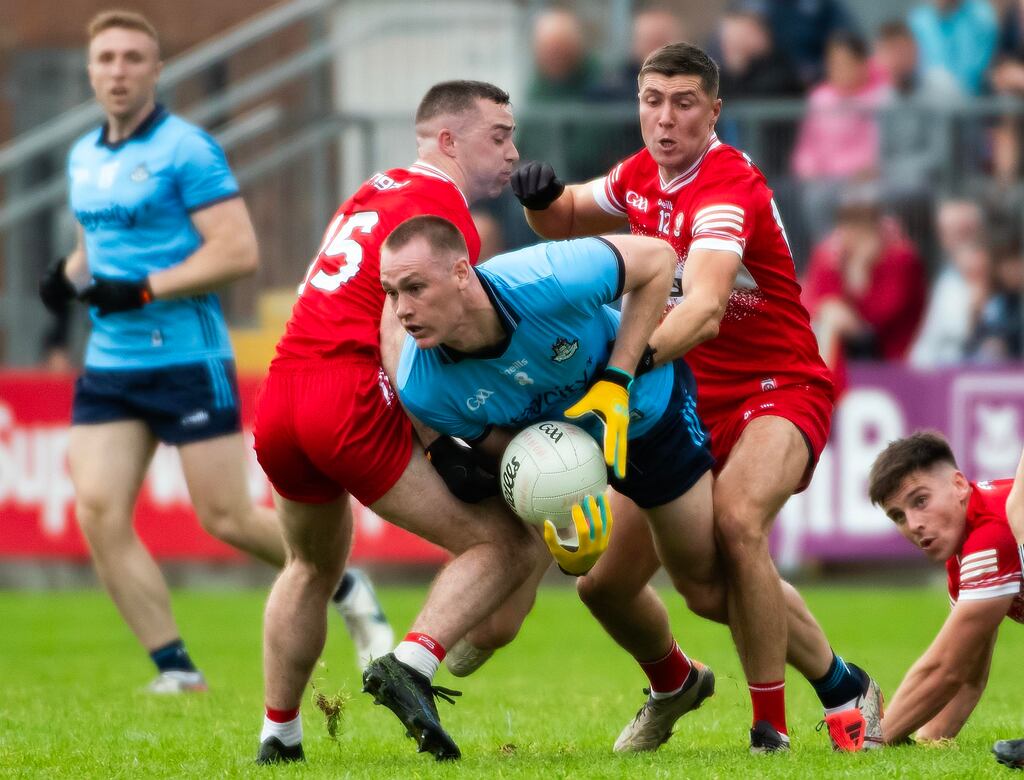 Peadar Ó Cofaigh Byrne of Dublin fends off Derry’s Niall Toner and Ciaran McFaul. Photograph: Evan Logan/Inpho