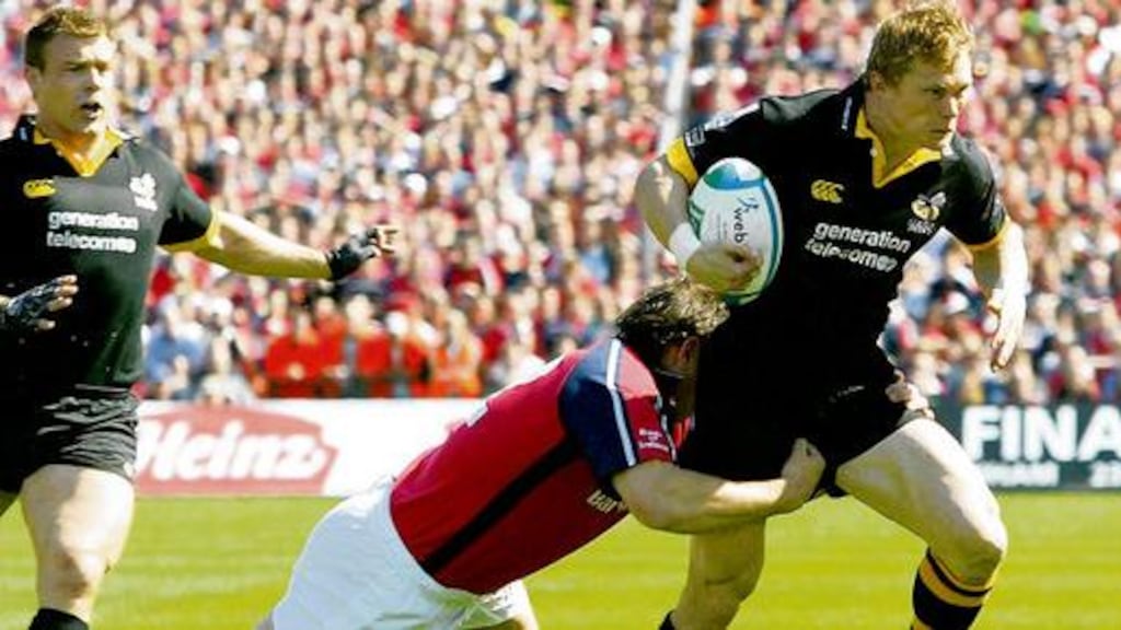 Josh Lewsey gets the ball away under pressure from Brian O'Driscoll in the Six Nations match between Ireland and England, at Croke Park in 2007. photograph: eric luke/the irish times
